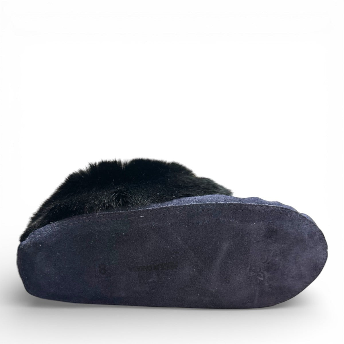 Alberta navy cowhide suede moccasins with a plush black rabbit fur ankle collar, handcrafted design.
photo of the bottom side