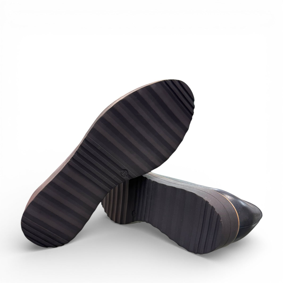 DJANGO & JULIETTE OCLEM navy leather platform loafers with a sporty rubber wedge sole and slip-on design. BOTTOM VIEW