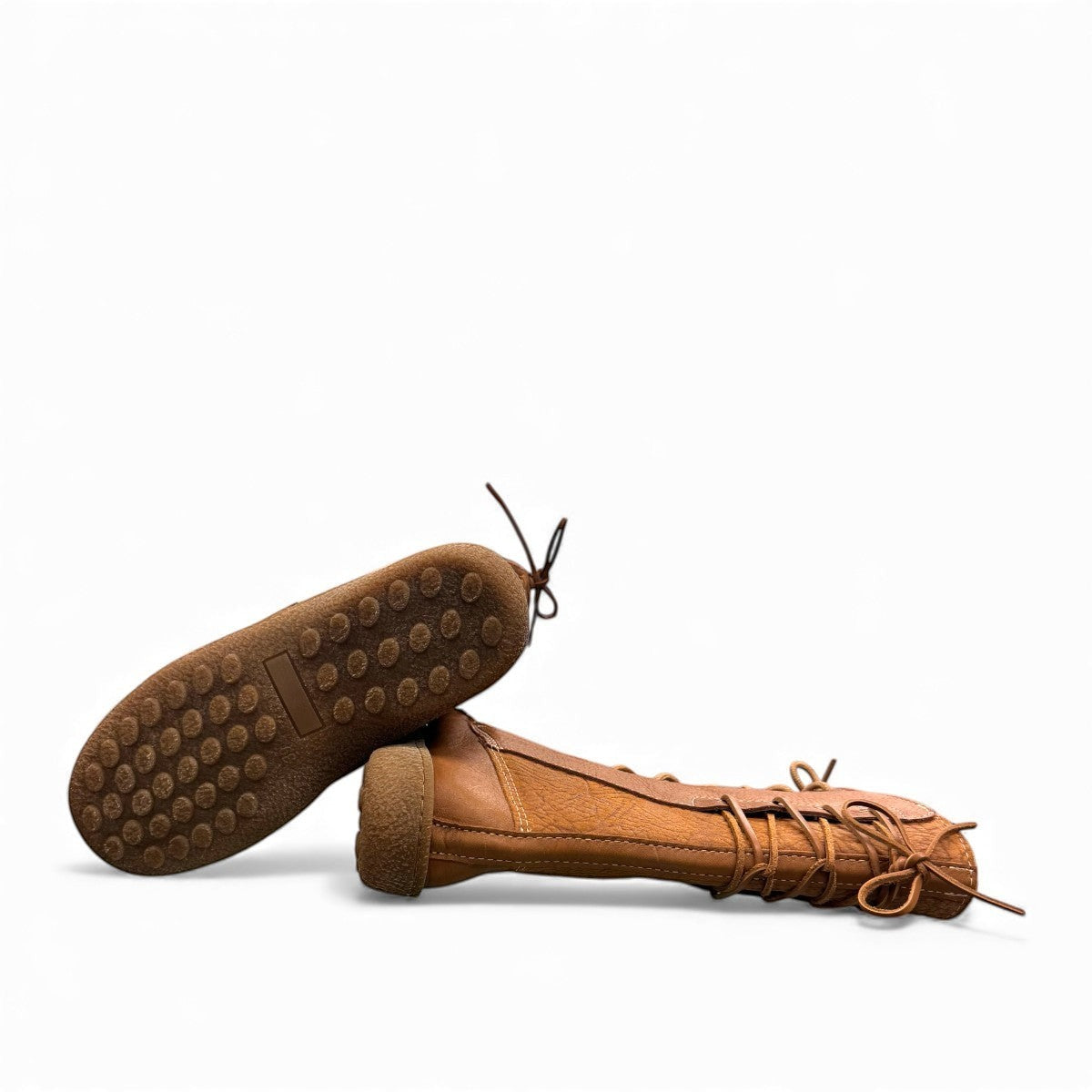 Laurentian Chief mukluk boots in cognac moose hide leather with lace-up front and moccasin stitching.