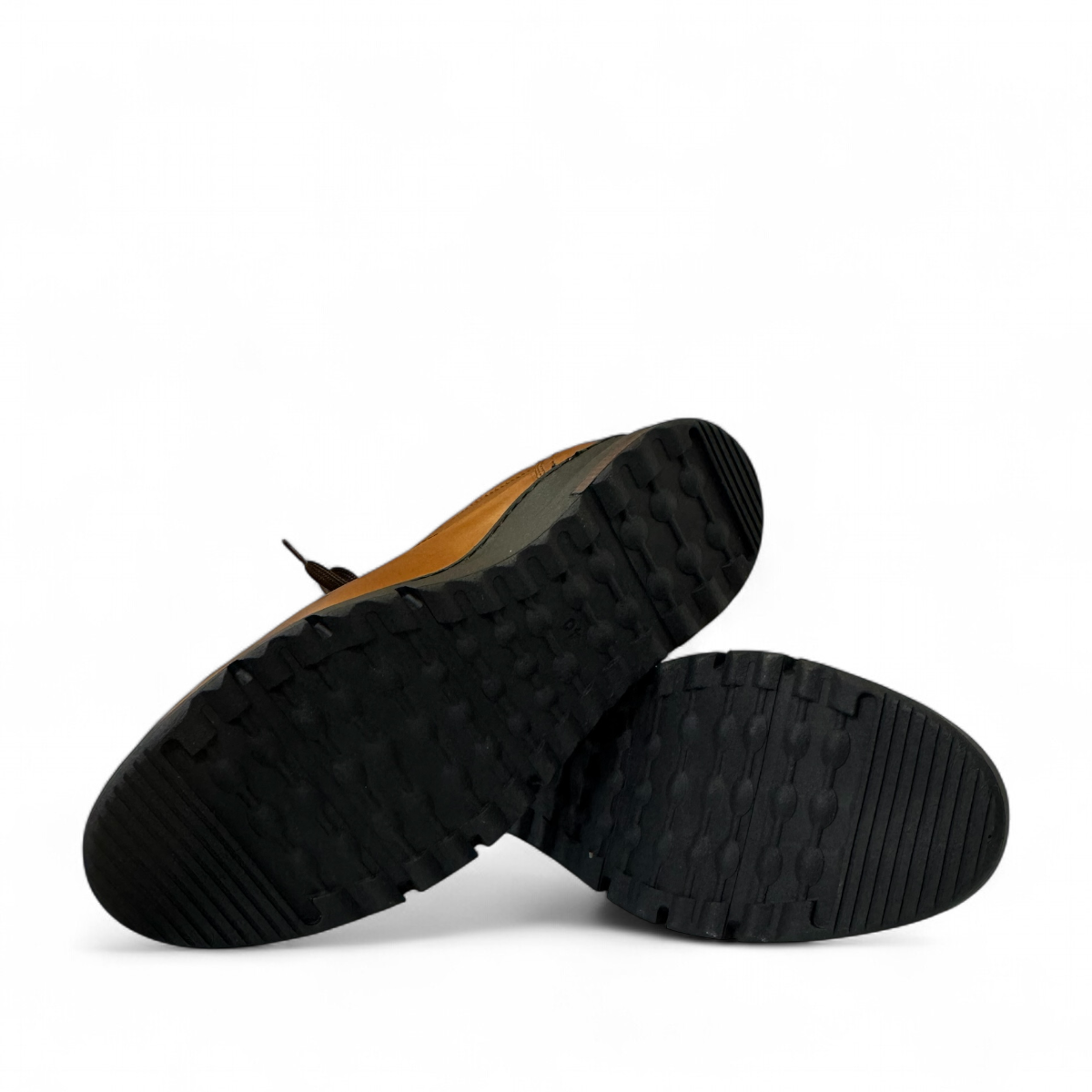 Satel Abgineh brown leather lace-up shoe with perforated detail and a durable black rubber outsole. Photo of bottom view.