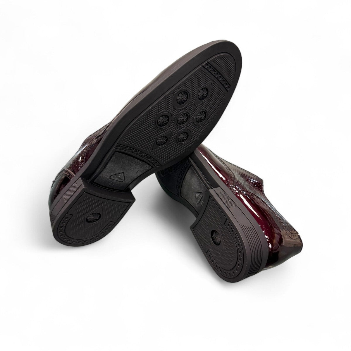 Sun Niko red patent leather lace-up dress shoe with textured detailing and durable rubber outsole. Photo of bottom view.