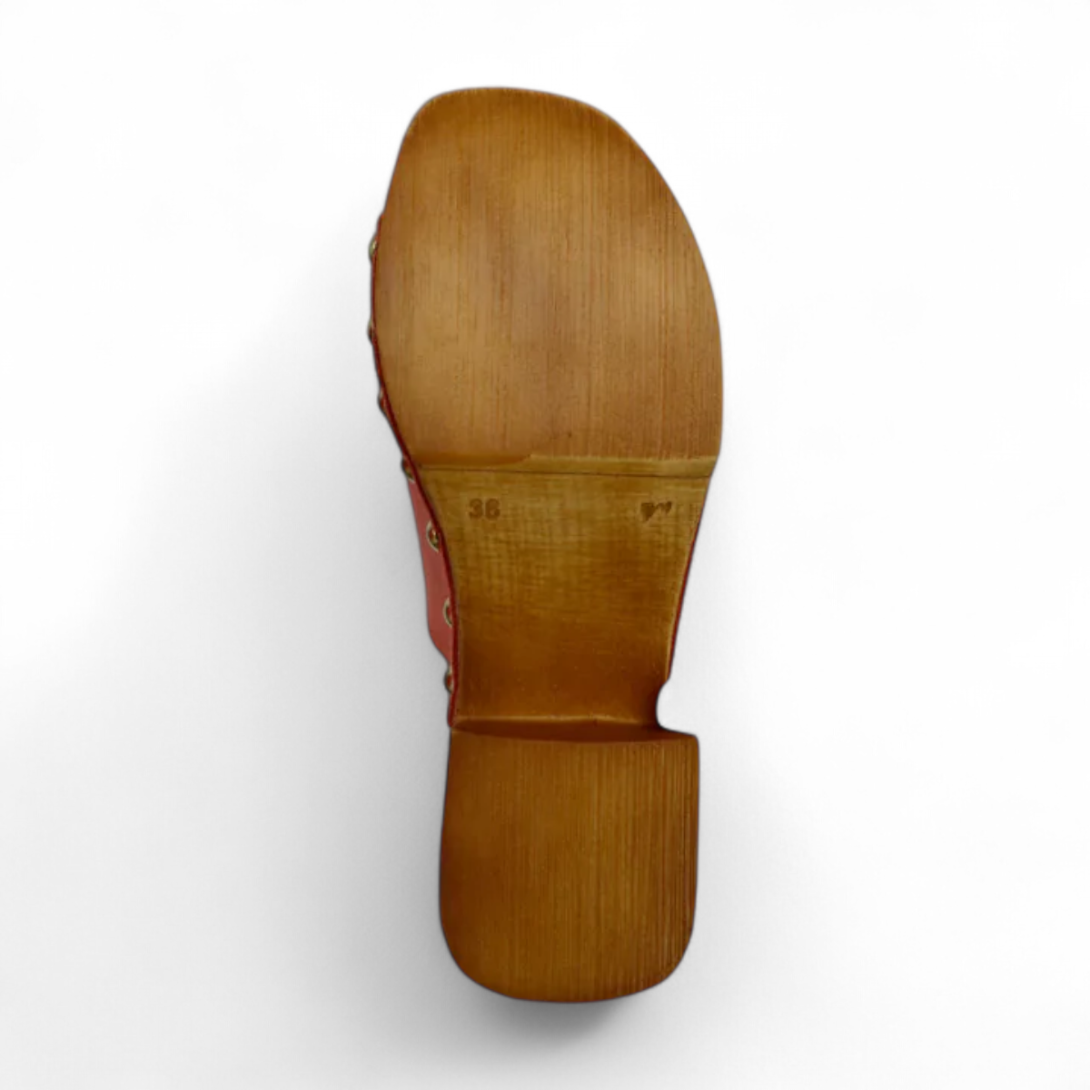 Tyche Bella coral leather slip-on clog with gold rivet accents and a wooden block heel. Photo of bottom view.
