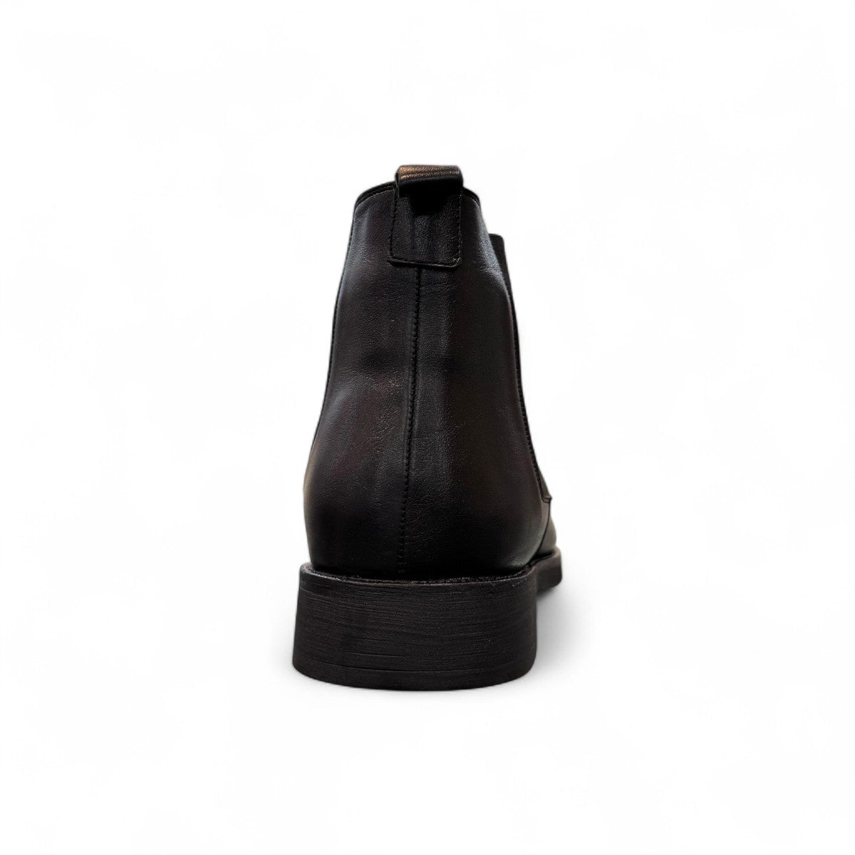Agera Arta black leather Chelsea boots with elastic side panels and a durable rubber outsole. Photo of back view.