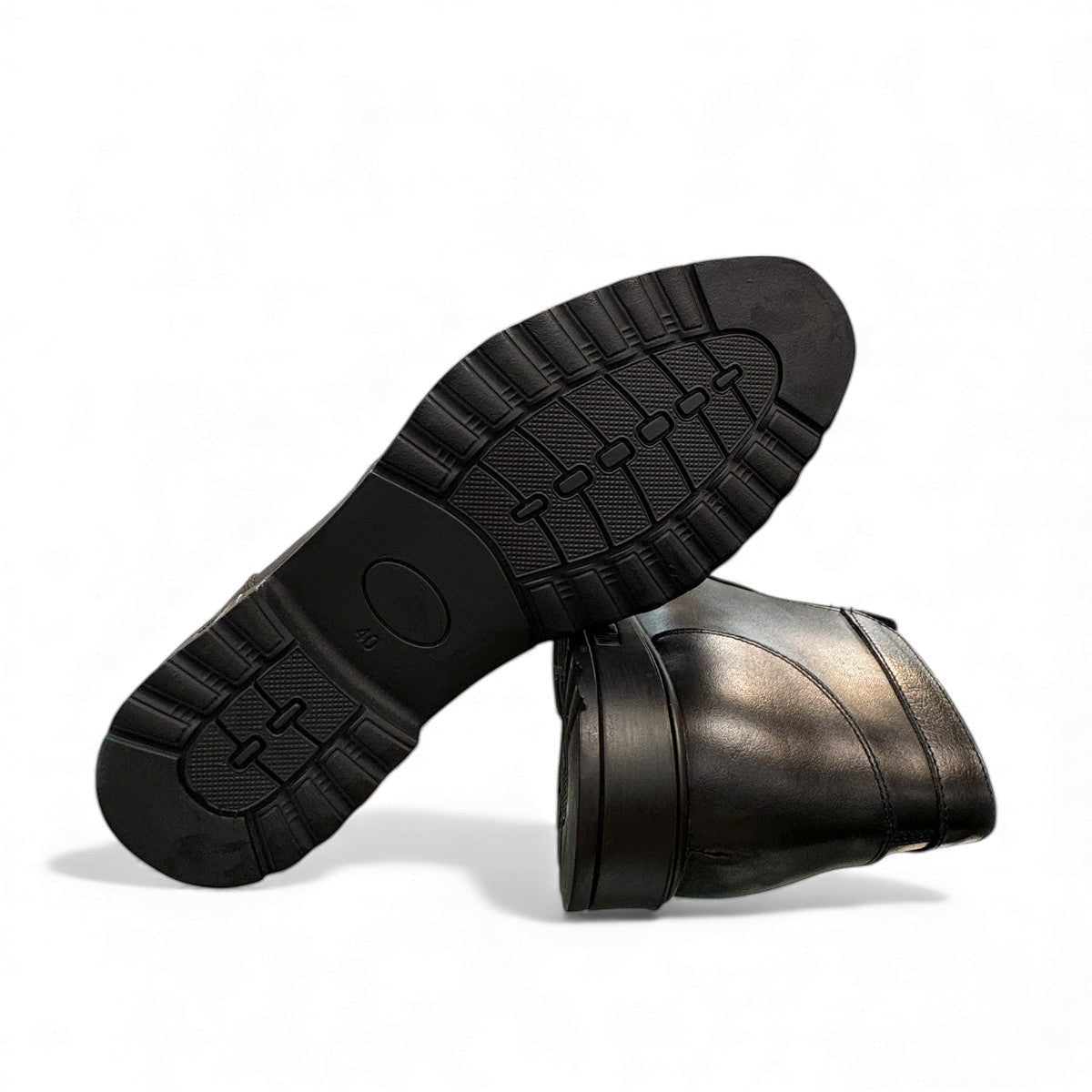 Atropat Nezami black genuine leather ankle boots with handmade stitching and durable rubber outsole. Photo of bottom view.