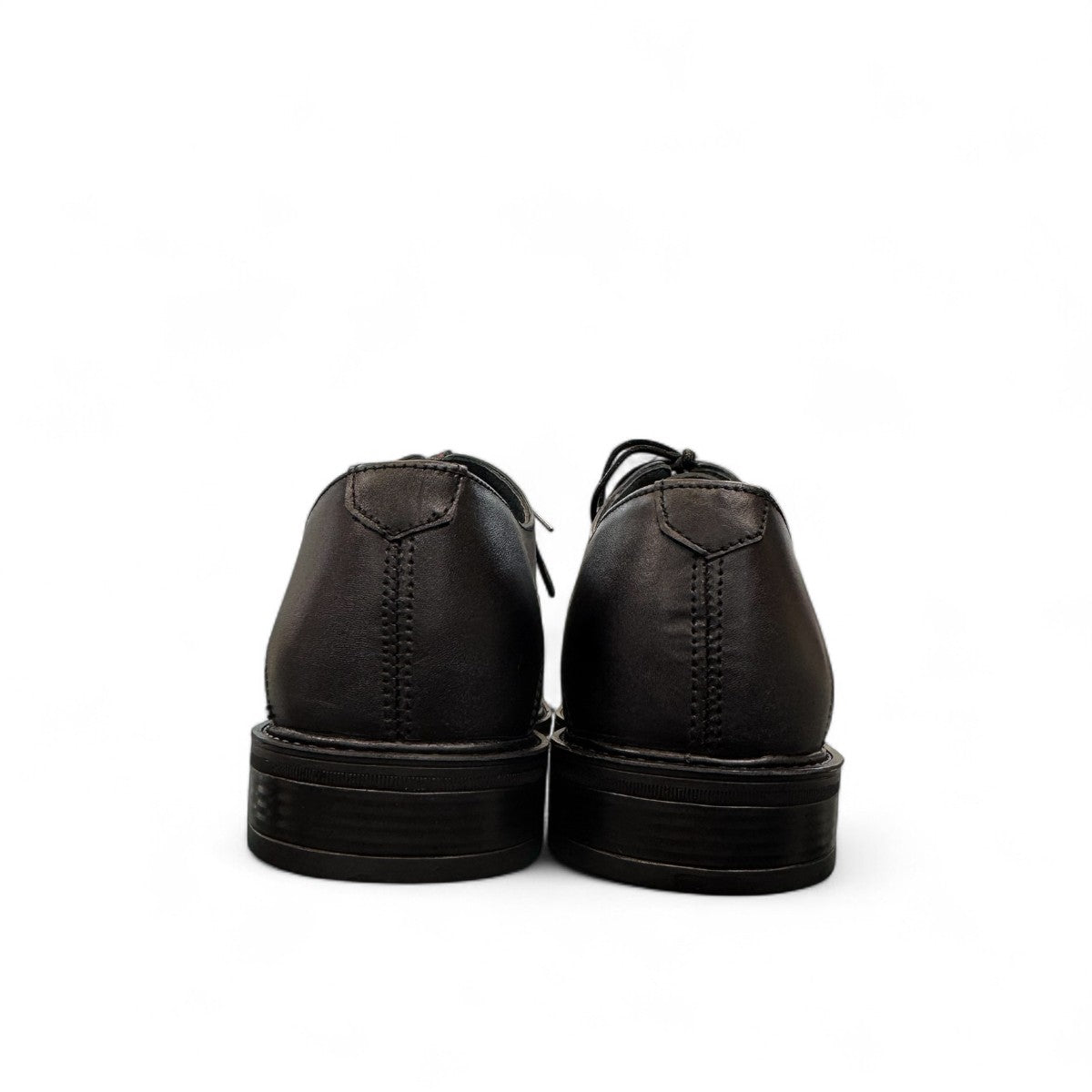 BORNA DRESSY black leather oxford shoes with brogue detailing and a durable rubber outsole. Photo of back view.