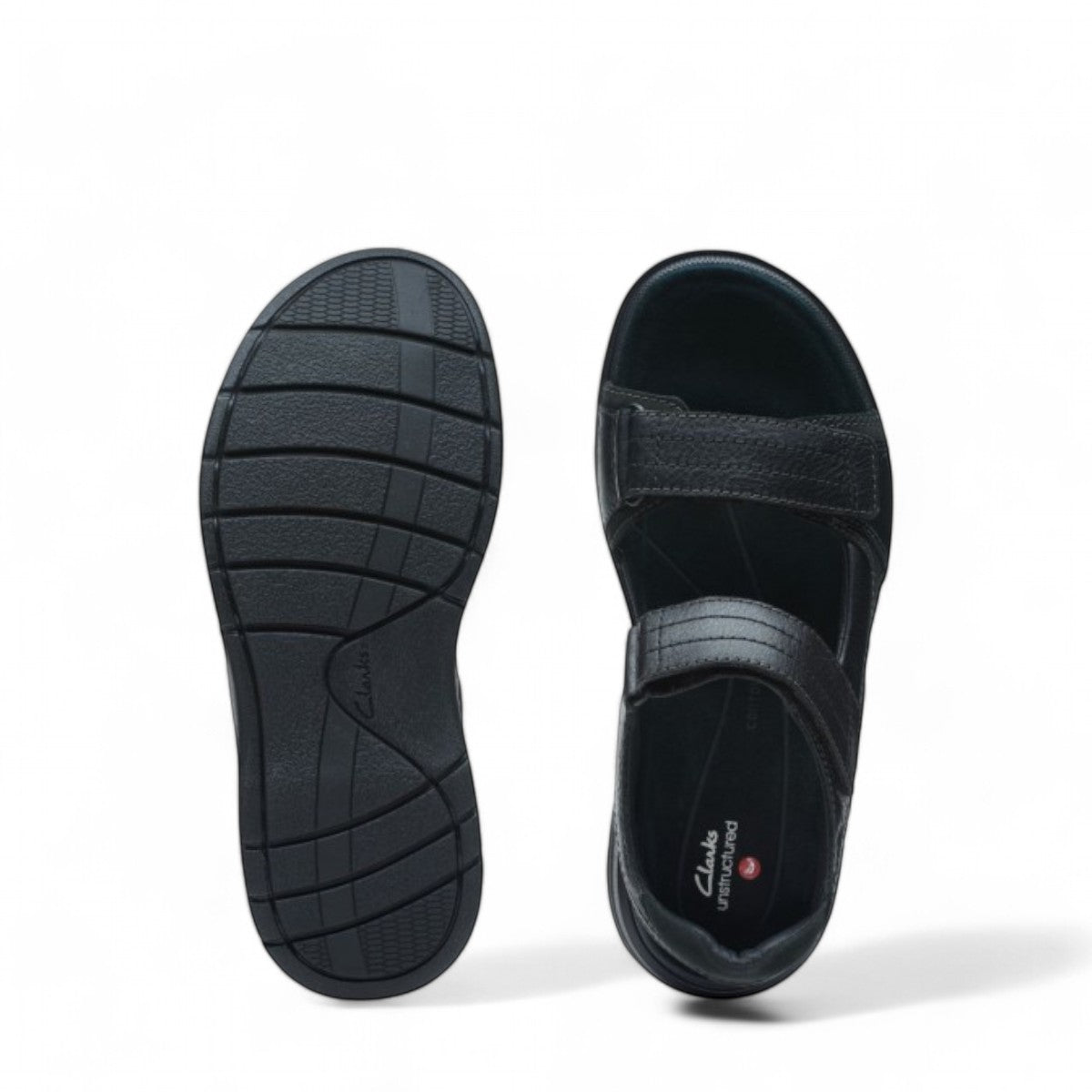 Clarks Nature Trek black nubuck leather sandal with adjustable hook and loop straps and rubber sole.
Photo of the top.