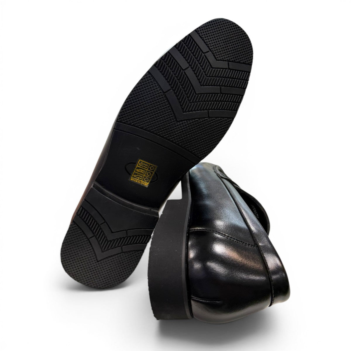 collexion-f7067m black leather penny loafer with a classic slip-on design for professional and smart-casual wear.
photo of the bottom side