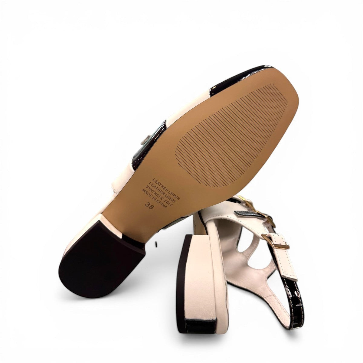 DJANGO & JULIETTE Brynins black and white patent leather slingback Mary Jane flat with block heel. bottom view.