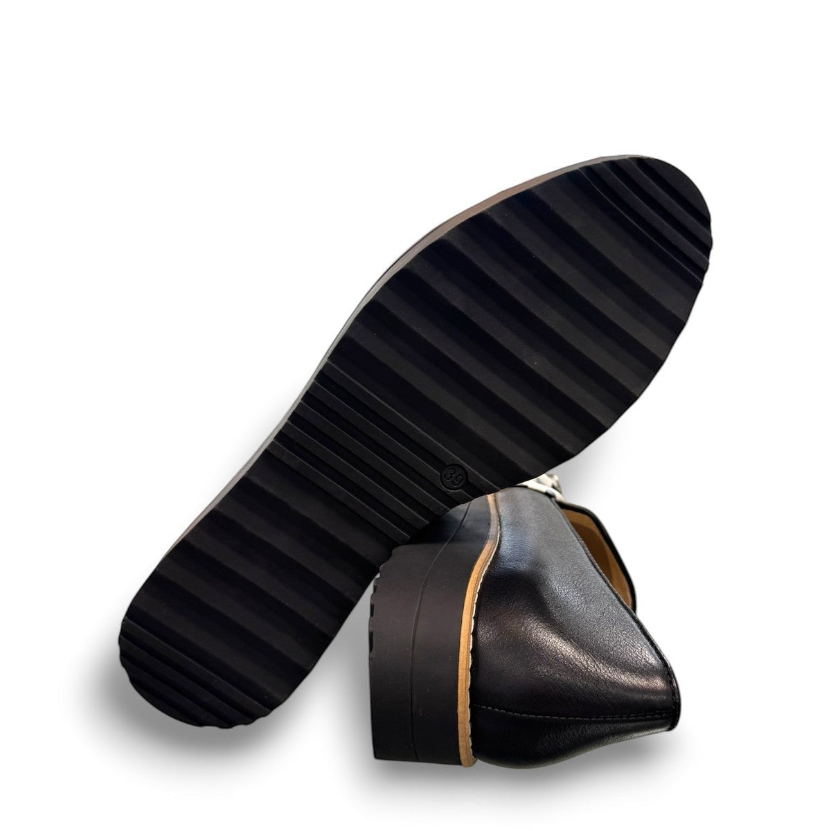 DJANGO & JULIETTE black leather platform loafers with a white and black polka dot bow detail. bottom view.