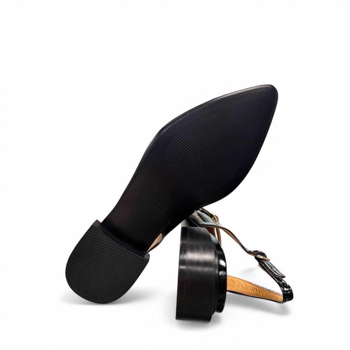 DJANGO & JULIETTE Eshano black patent leather slingback flat with triple buckle detail and low heel.
bottom view.