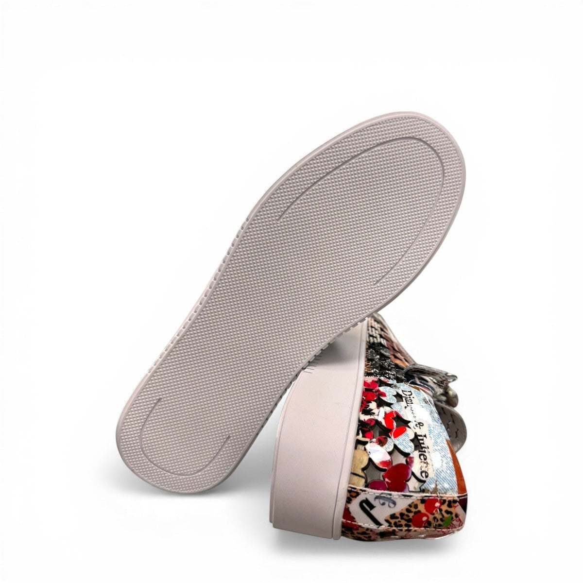 Django & Juliette Leithah leather sneakers featuring a colorful collage print and white platform sole. bottom view.