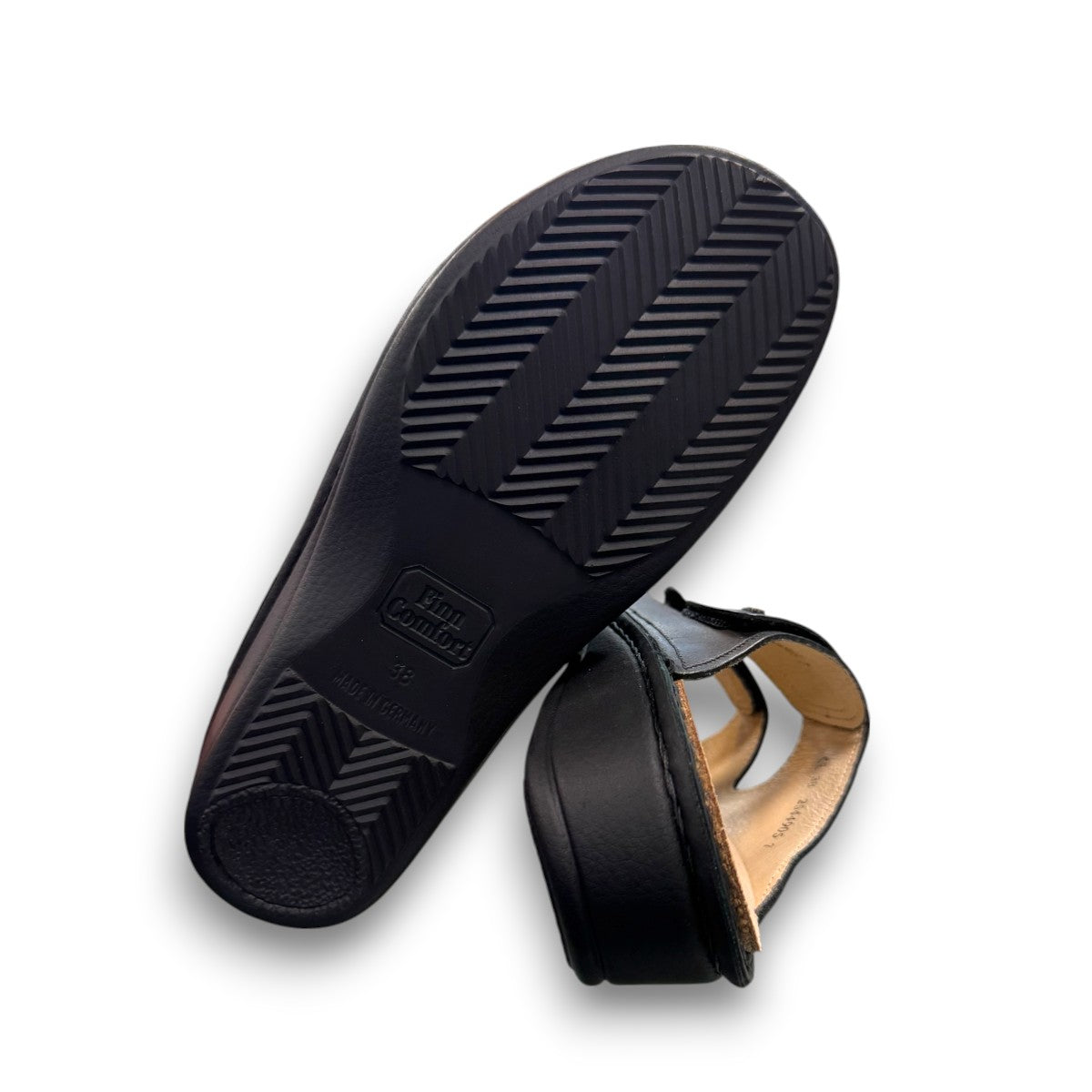Finn Comfort Jamaica black nappa leather slide sandals with two adjustable hook and loop straps.
photo of the bottom side