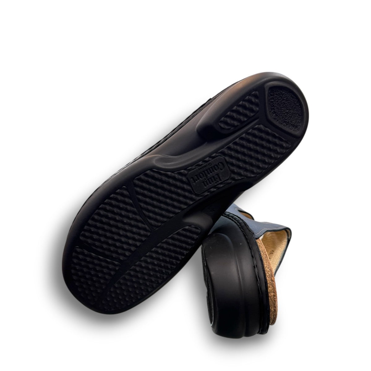 Finn Comfort Sansibar blue leather sandal with two adjustable hook and loop straps and cork footbed.
photo of the bottom side