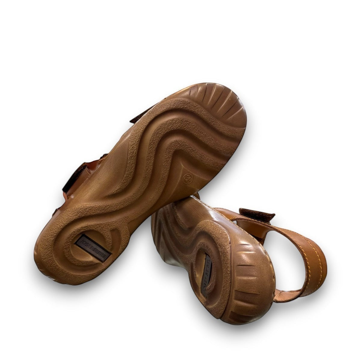 Josef Seibel Debra 019 castagne/kombe brown leather sandals showing the durable handstitched wavy tread soles