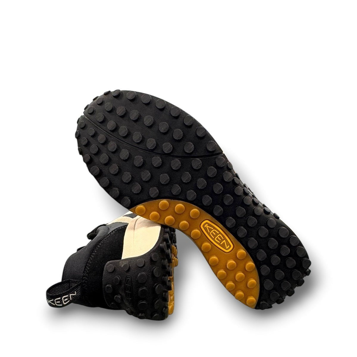 KEEN KS86 women's sneaker in black and birch leather with an aggressive trail-ready rubber outsole.