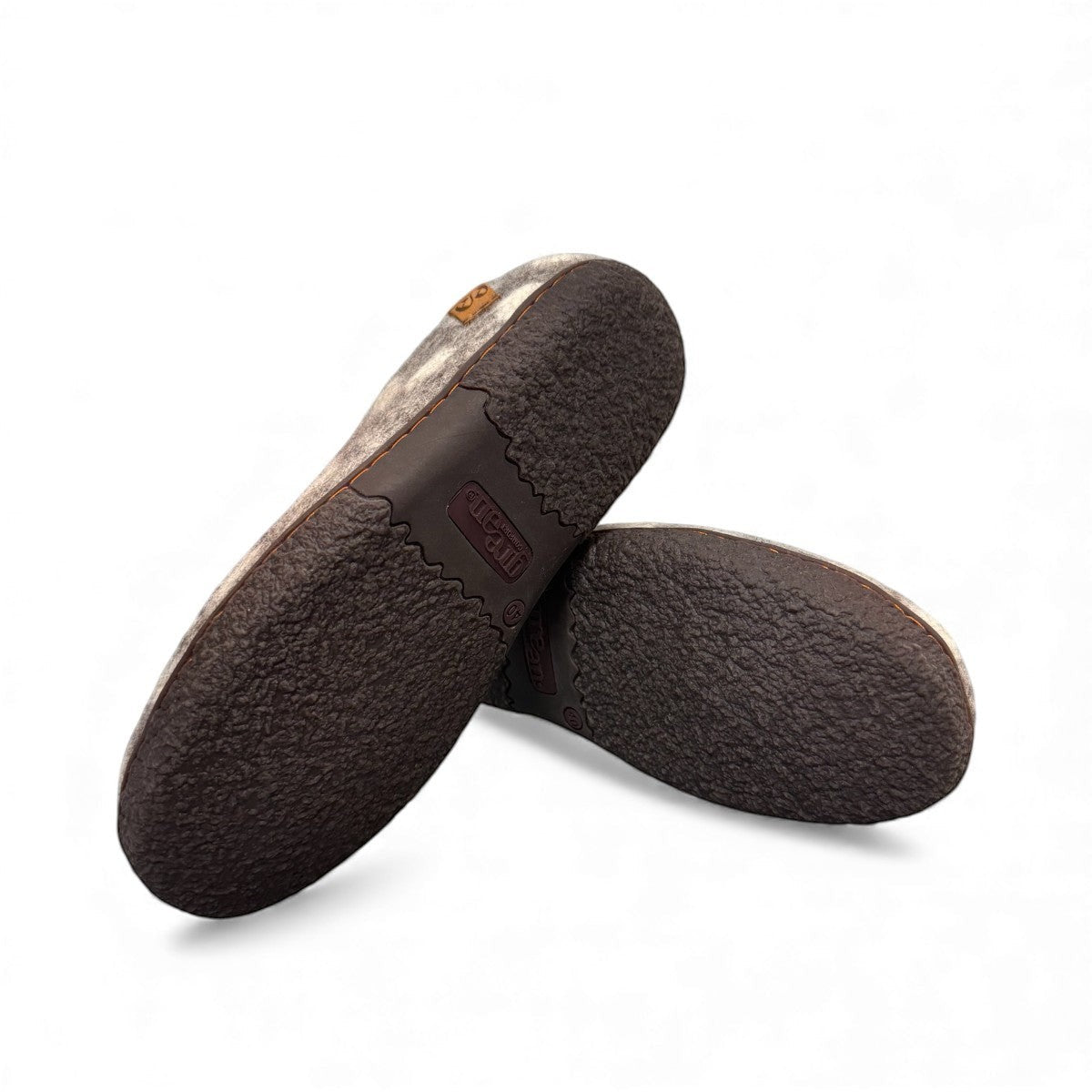 Lhasa grey wool mule slippers showing the textured brown EnergySole rubber outsoles