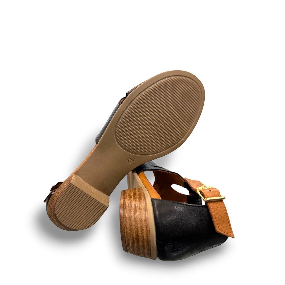Roamers Mae black and tan leather sandals with side buckle and low block heel.
photo of the bottom side