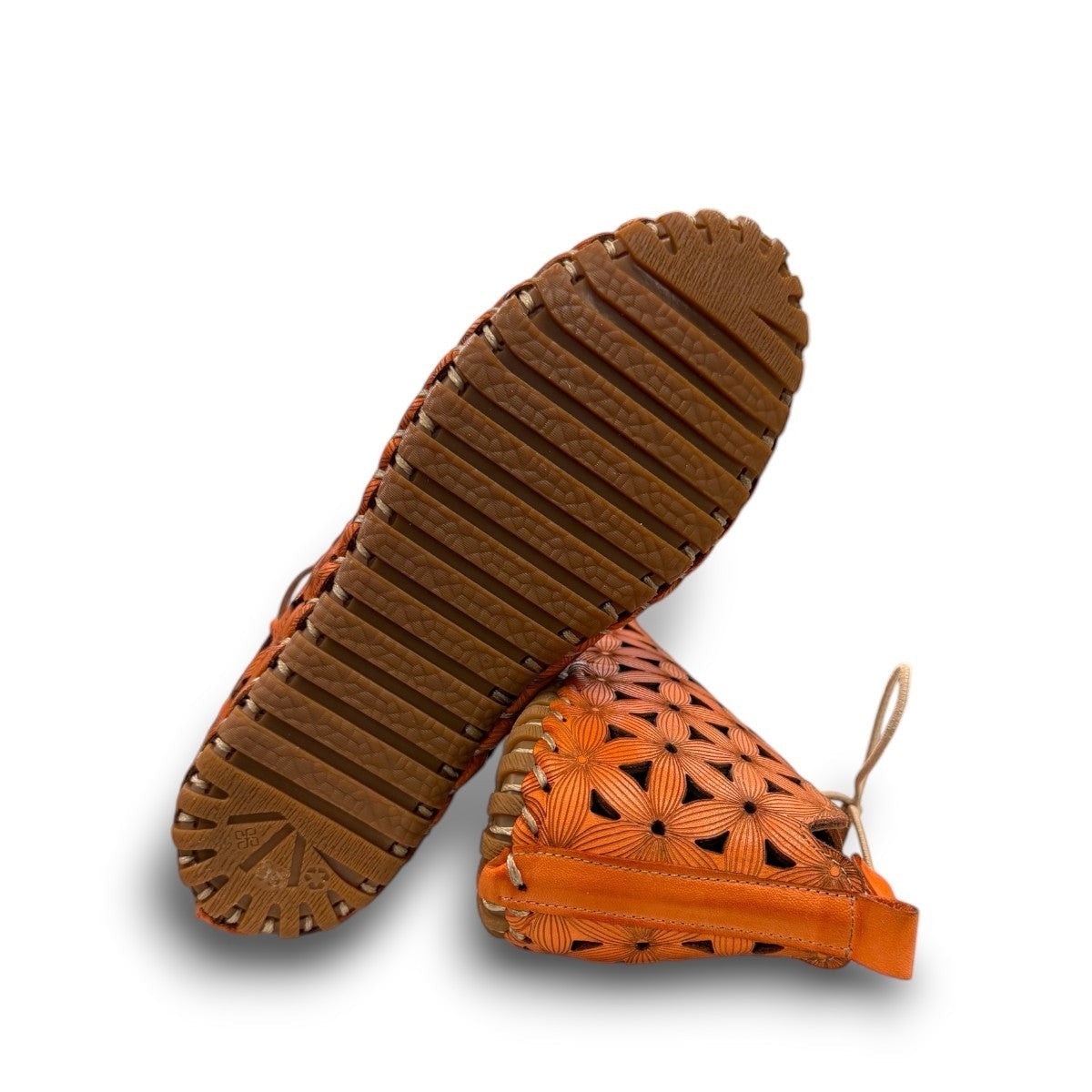 Roamers Venus ankle shoes in sun burn orange leather with decorative floral cutouts and elastic lacing.
photo of the bottom