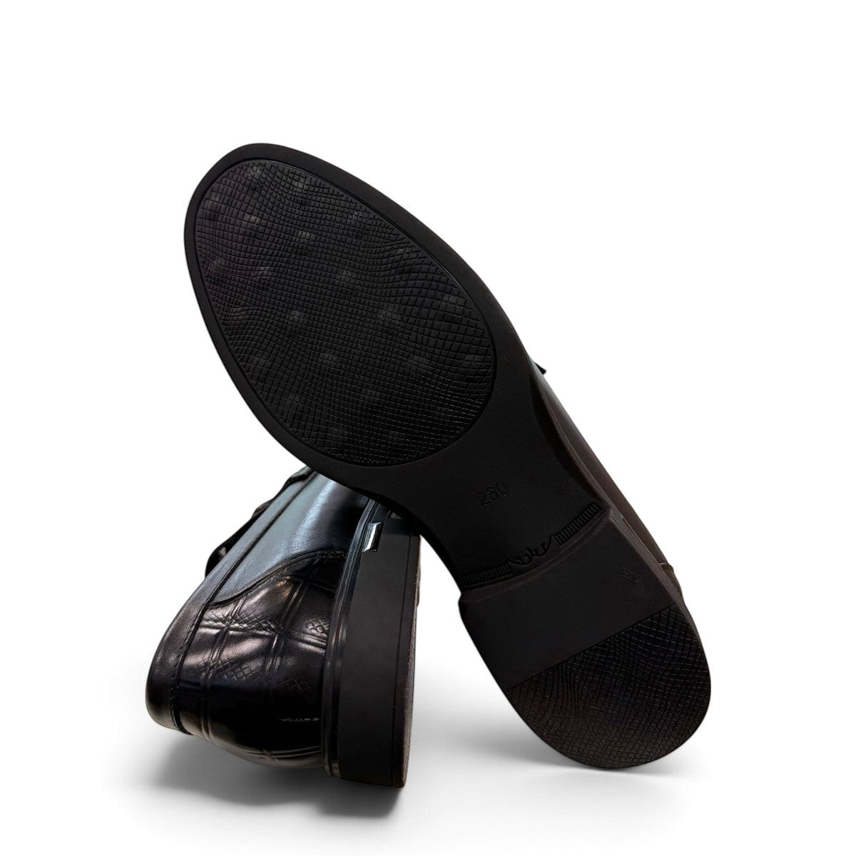 Sina Footwear black genuine leather loafers with a crocodile-embossed texture and a sleek slip-on design.
photo of the bottom side