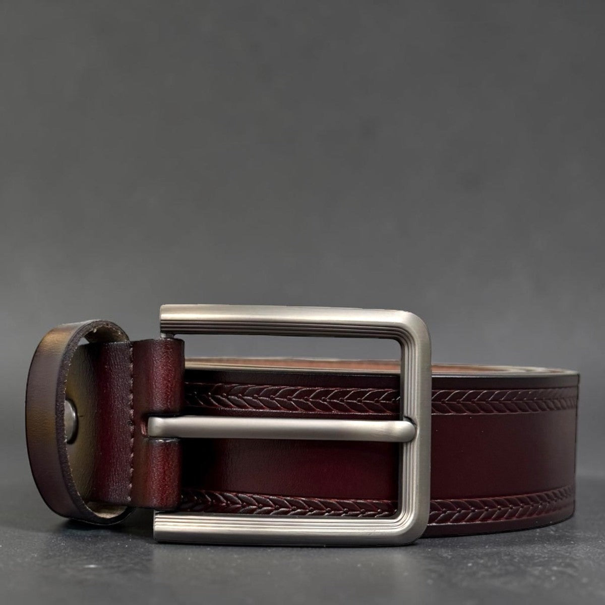 Sina Footwear men's dark brown genuine leather belt with a sleek silver buckle and braided detail.