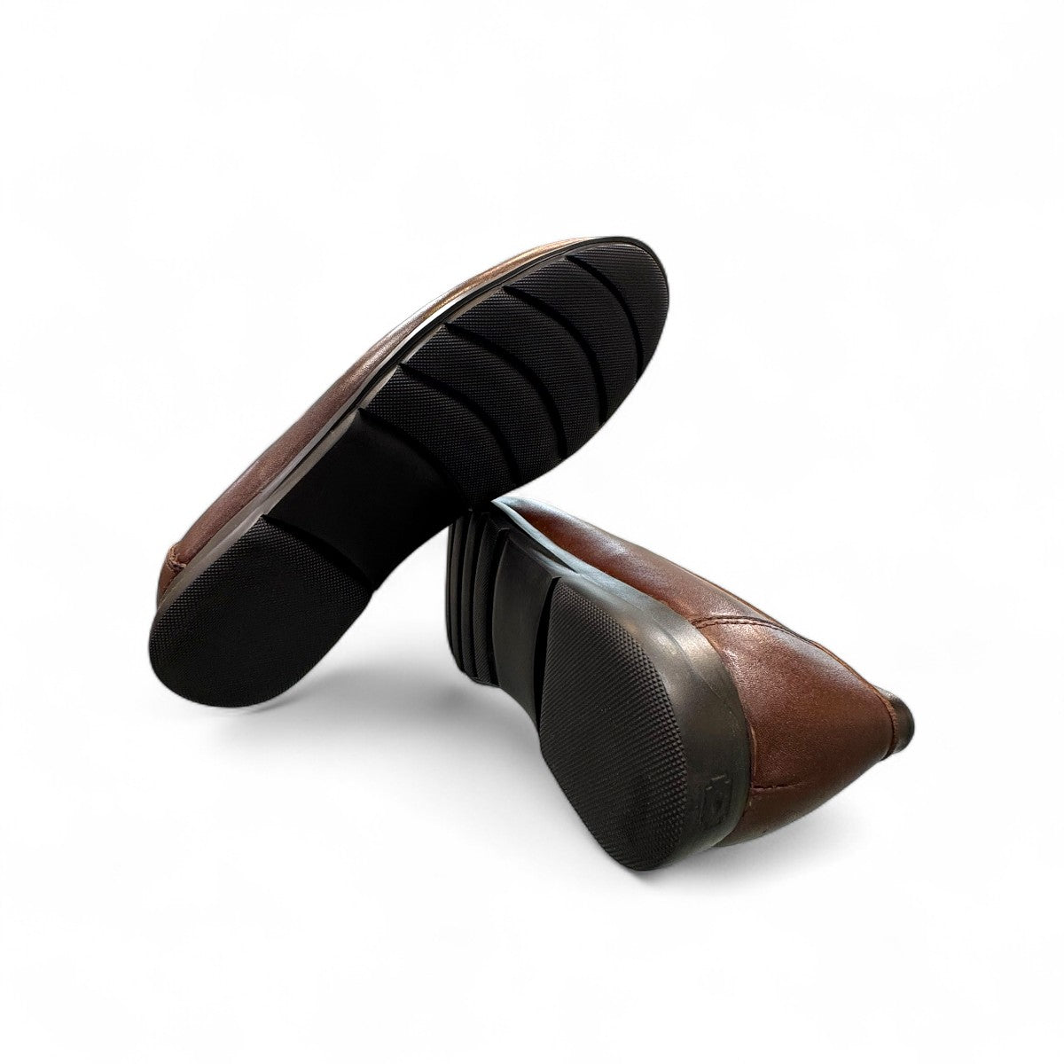 Sina Footwear Vanak dark brown leather loafers featuring handmade stitching and a durable rubber outsole. Photo of bottom view.