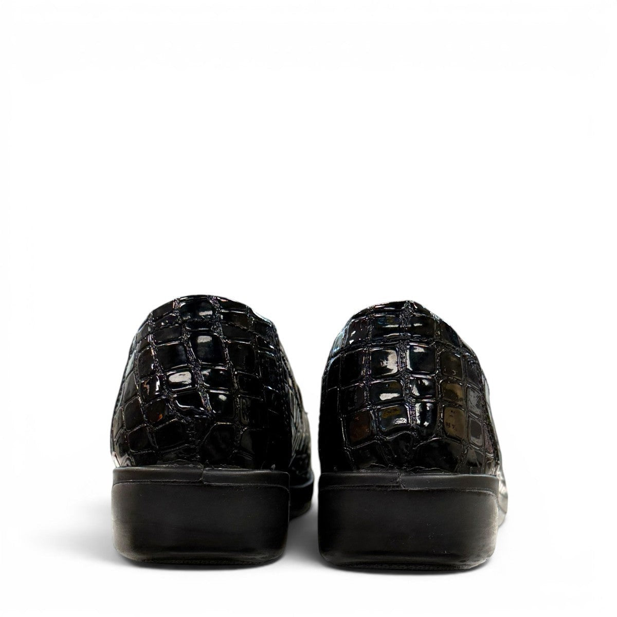 Stefania black croc-embossed slip-on shoe with a low wedge sole and elastic side panel for comfort.
photo of the back side