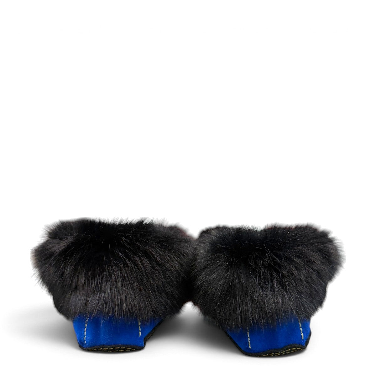 Alberta blue suede moccasin with a black rabbit fur ankle collar, handcrafted for cozy indoor comfort. Photo of back view.