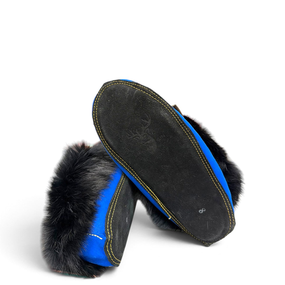 Alberta blue suede moccasin with a black rabbit fur ankle collar, handcrafted for cozy indoor comfort. Photo of bottom view.