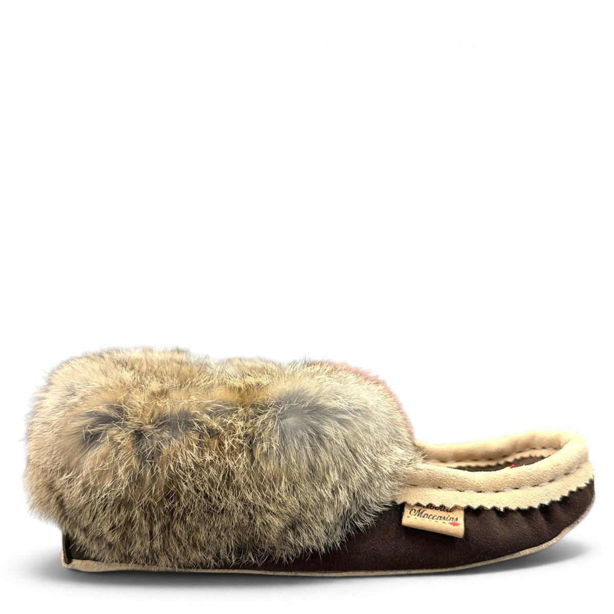 Alberta brown suede moccasin with cream trim and fluffy rabbit fur ankle collar, side view. Photo of right side view.