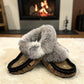 Alberta brown suede moccasins with a soft fur ankle collar, side view. Photo of front side view.