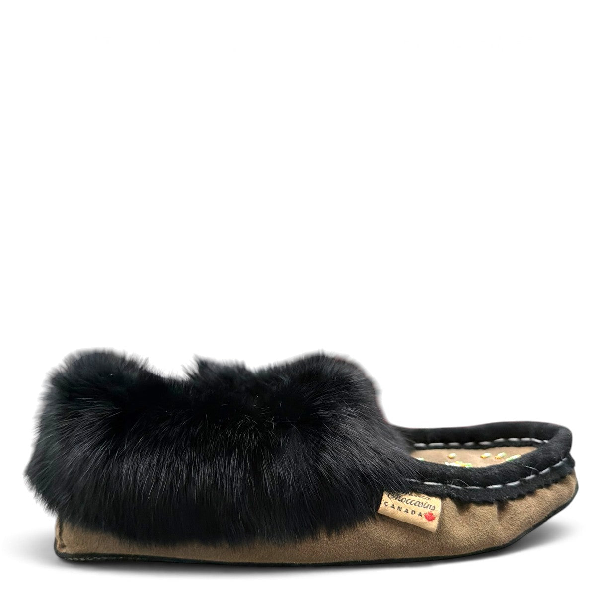 Alberta coffee brown suede moccasin with a plush black rabbit fur ankle collar. Photo of right side view.