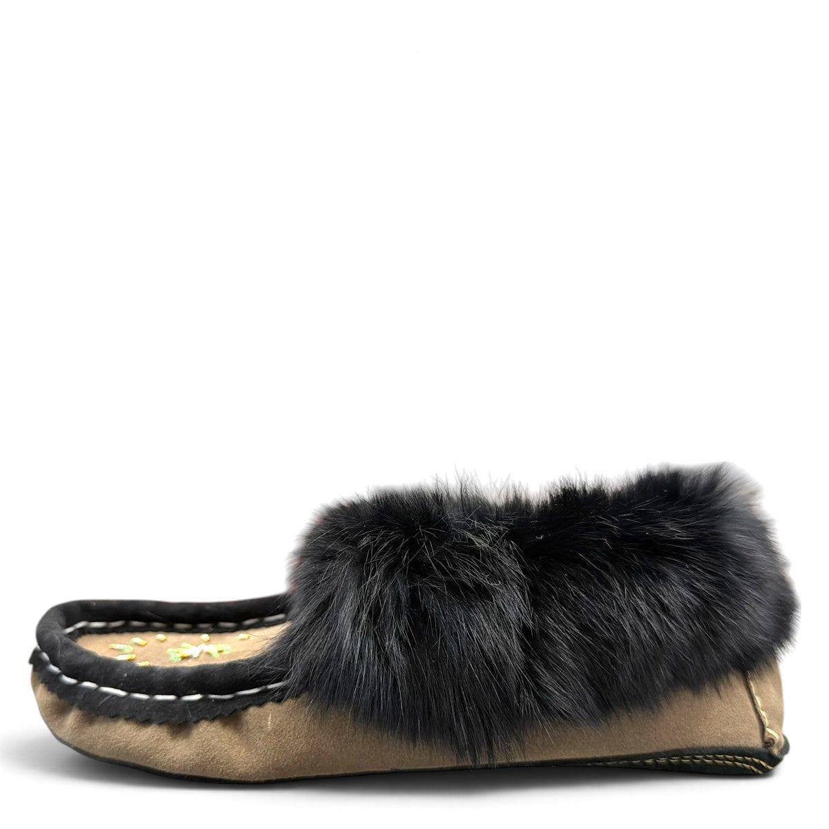 Alberta coffee brown suede moccasin with a plush black rabbit fur ankle collar. Photo of left side view.