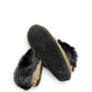 Alberta coffee brown suede moccasin with a plush black rabbit fur ankle collar. Photo of bottom view.