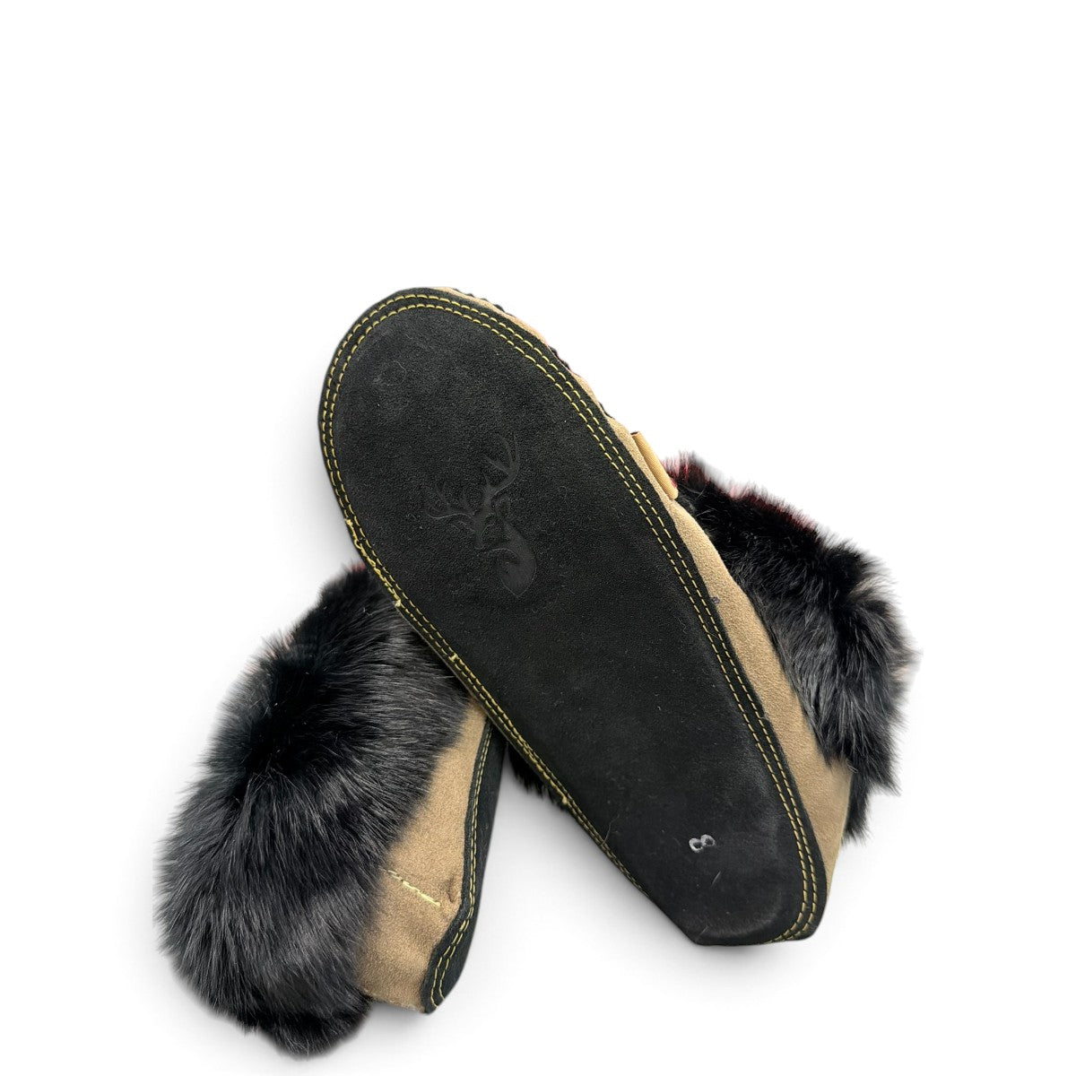 Alberta coffee brown suede moccasin with a plush black rabbit fur ankle collar. Photo of bottom view.