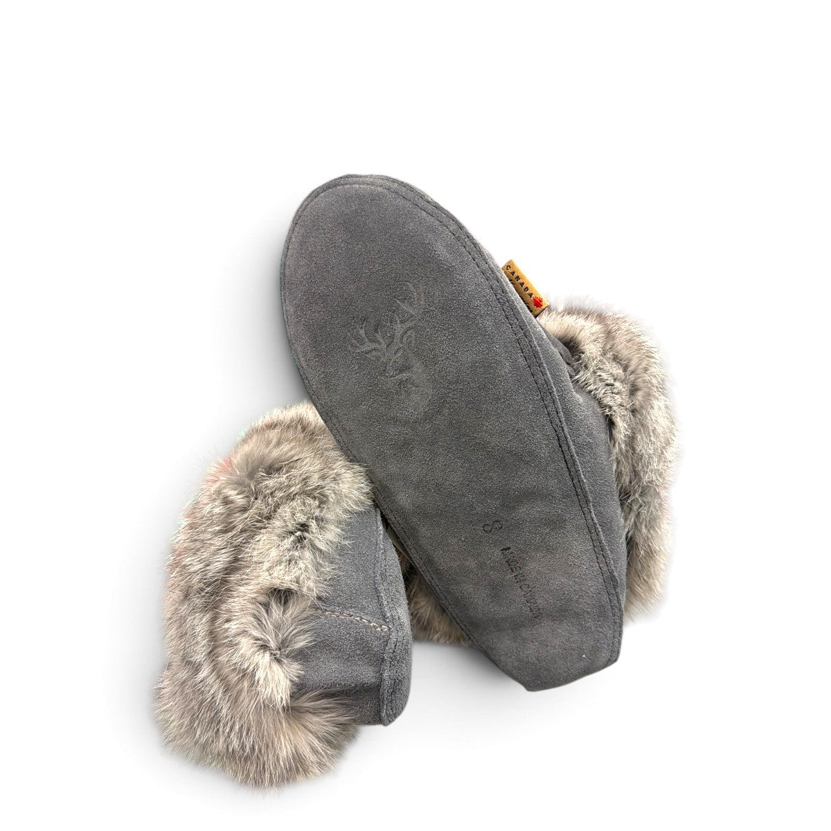 Alberta dark grey suede moccasins with a plush rabbit fur ankle collar, handcrafted for comfort. Photo of bottom view.