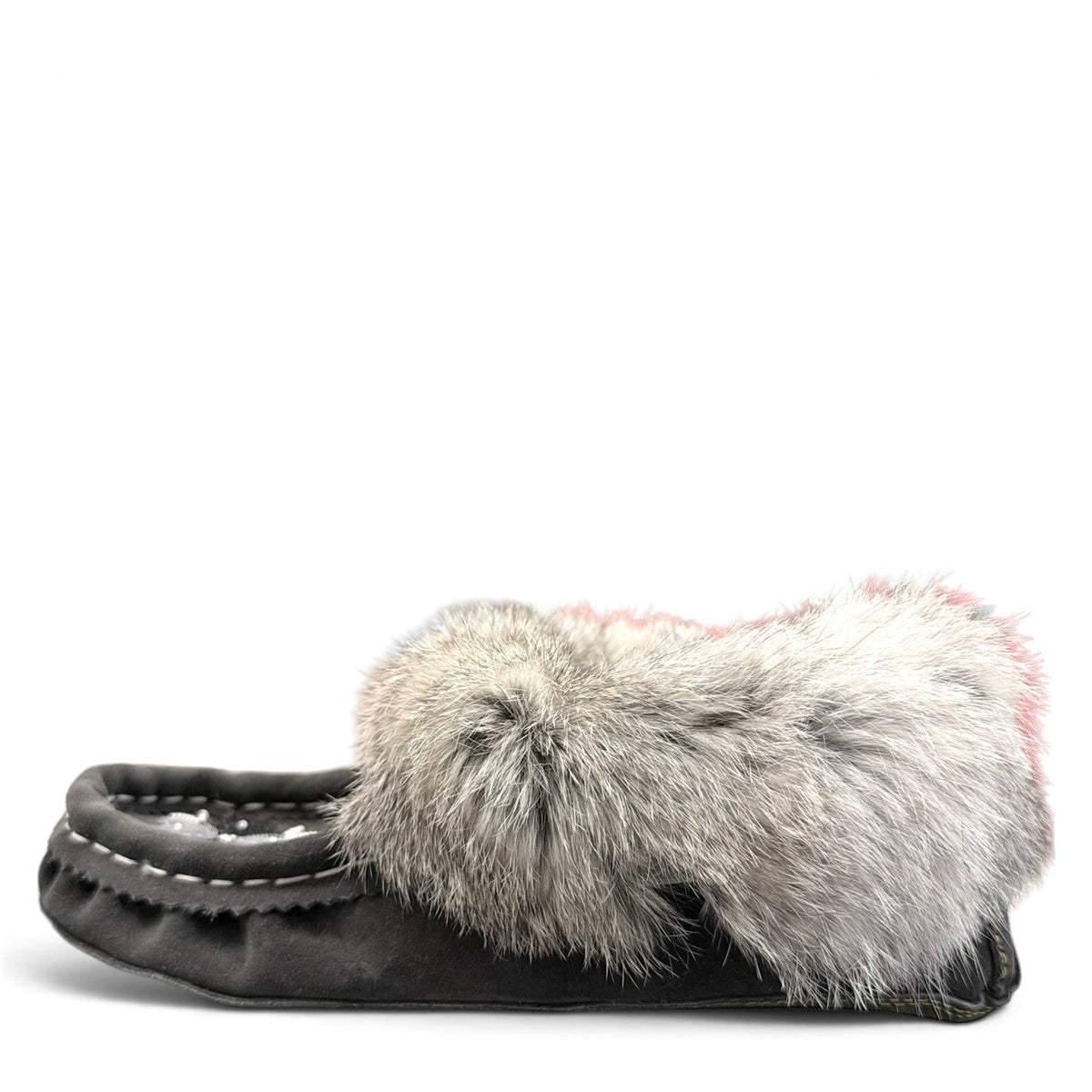 Alberta grey suede moccasins with a plush rabbit fur ankle collar and hand-stitched detailing. Photo of left side view.