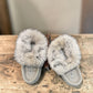 Alberta light grey suede moccasin with a fluffy rabbit fur ankle collar, handcrafted side view. Photo of upper view.