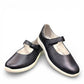 Alberta Milano Kira 02 blue metallic leather flats with a hook and loop strap and white textured sole. Photo of front side view 1.