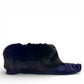 Alberta navy cowhide suede moccasins with a plush black rabbit fur ankle collar, handcrafted design.
photo of the right side