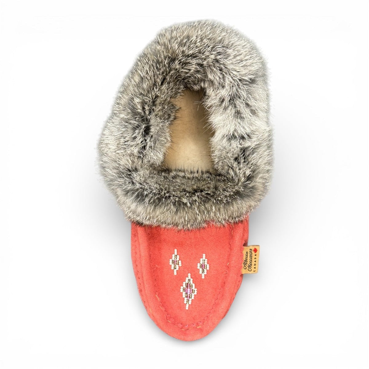 Alberta  peach cowhide suede moccasins with a soft rabbit fur ankle collar, handcrafted for cozy indoor comfort.
photo of the top side