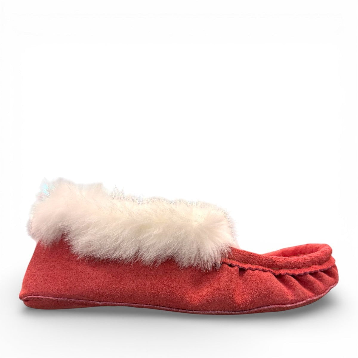 Alberta peach cowhide suede moccasins with a soft white rabbit fur ankle trim, handcrafted for cozy comfort.
photo of the right side