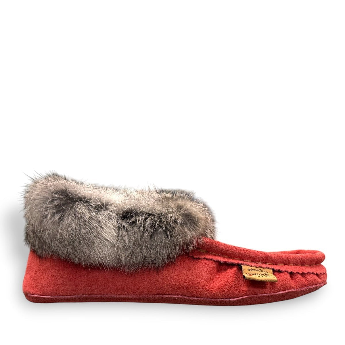 Alberta  peach cowhide suede moccasins with a soft rabbit fur ankle collar, handcrafted for cozy indoor comfort.
photo of the right side