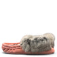 Alberta pink suede moccasins with a soft rabbit fur ankle collar, handcrafted for cozy comfort. Photo of left side view.