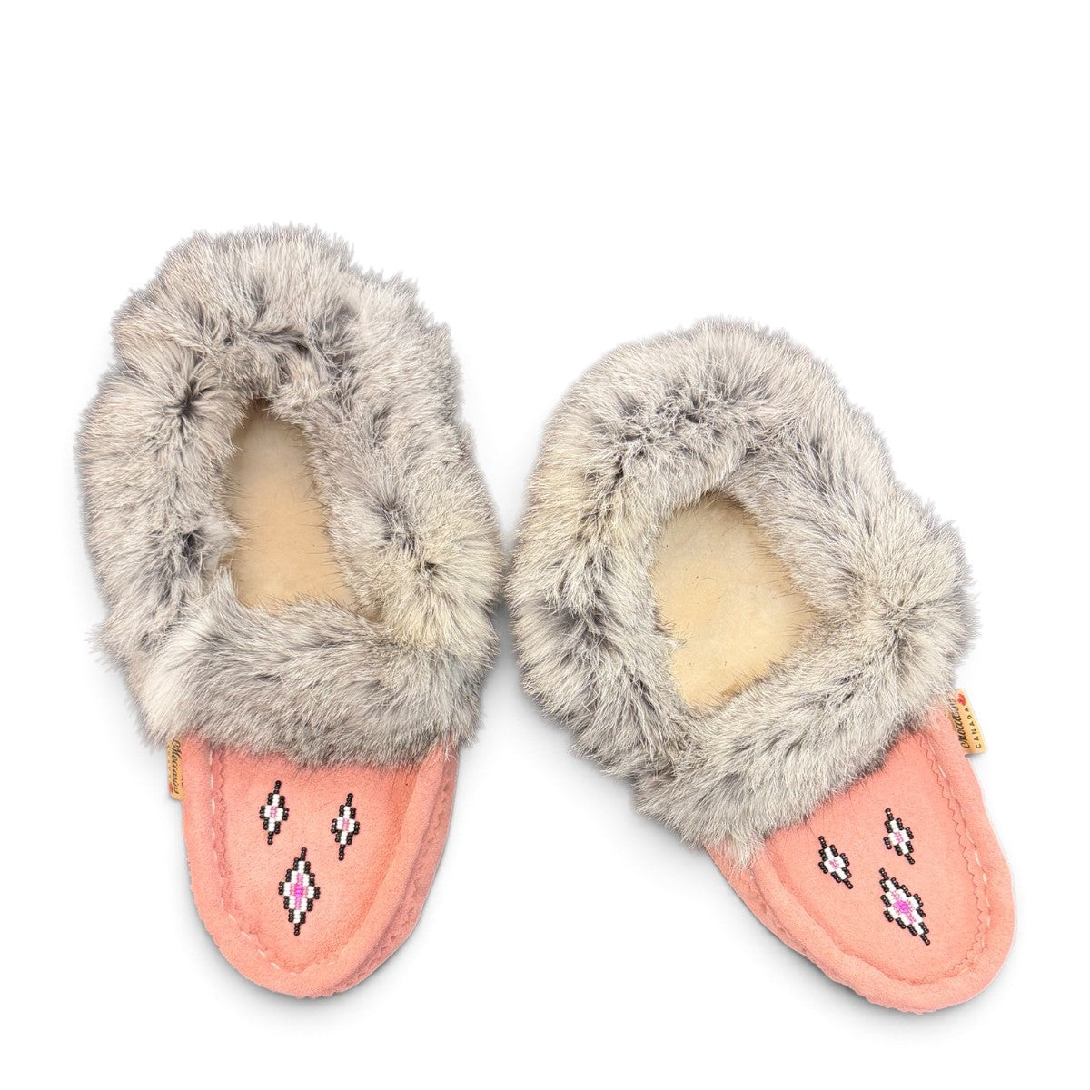 Alberta pink suede moccasins with a soft rabbit fur ankle collar, handcrafted for cozy comfort. Photo of upper view.