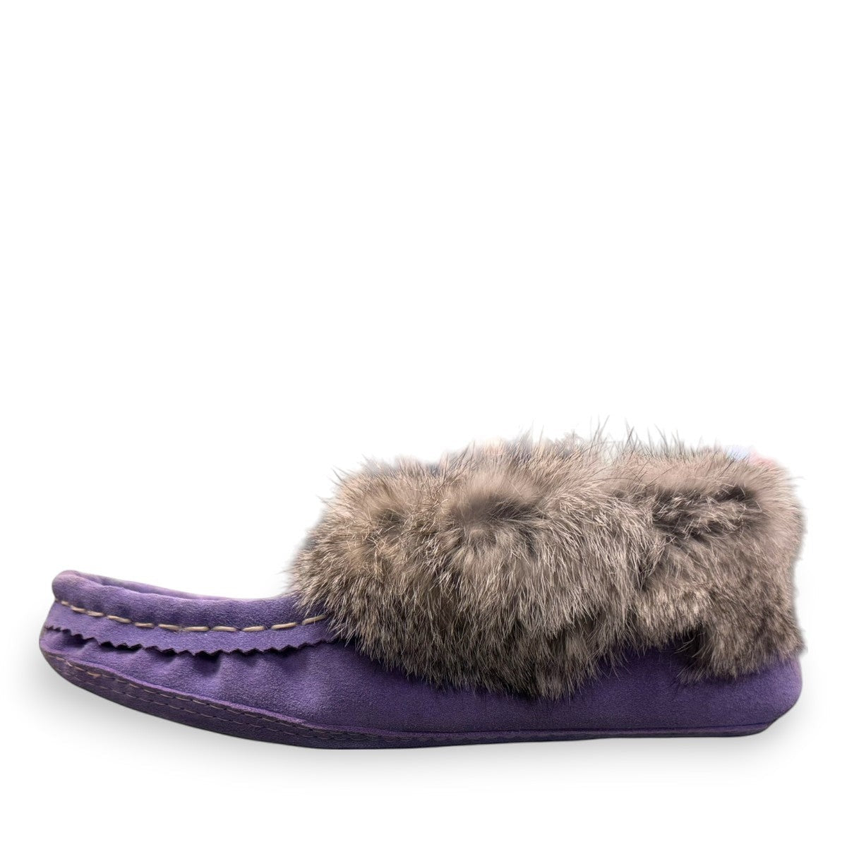 Alberta  purple cowhide suede moccasins with a soft rabbit fur ankle collar, handcrafted for cozy comfort.
photo of the left side