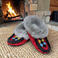 Alberta red suede moccasins with a grey fur ankle collar, handcrafted for cozy everyday wear. Photo of front side view.