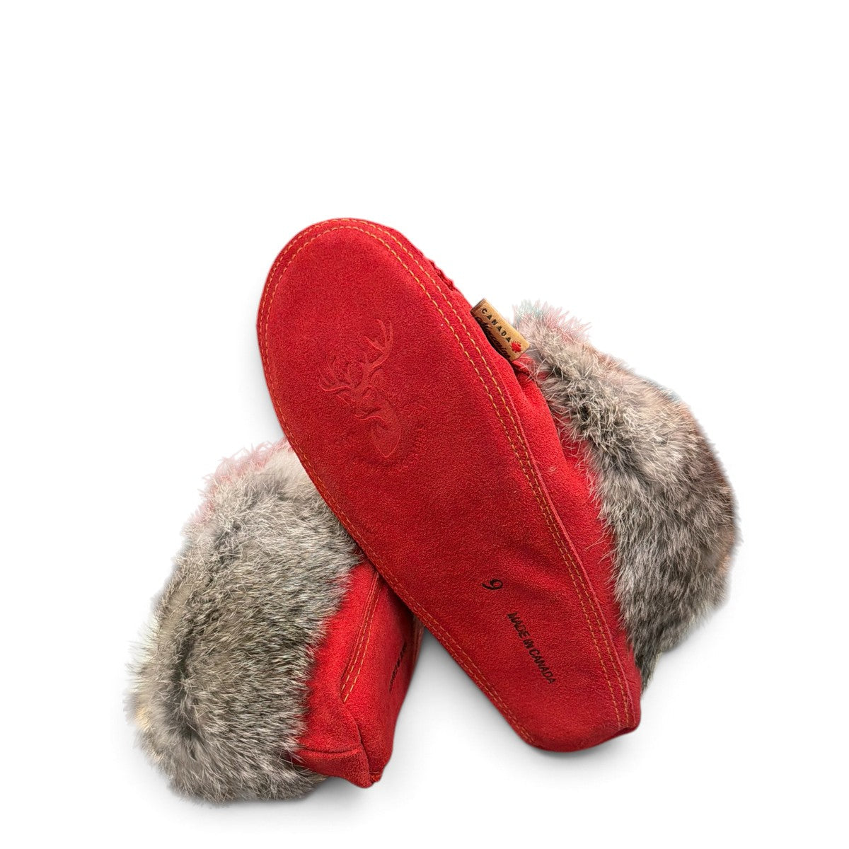 Alberta red suede moccasins with a fluffy rabbit fur ankle collar, handcrafted for cozy comfort. Photo of bottom view.