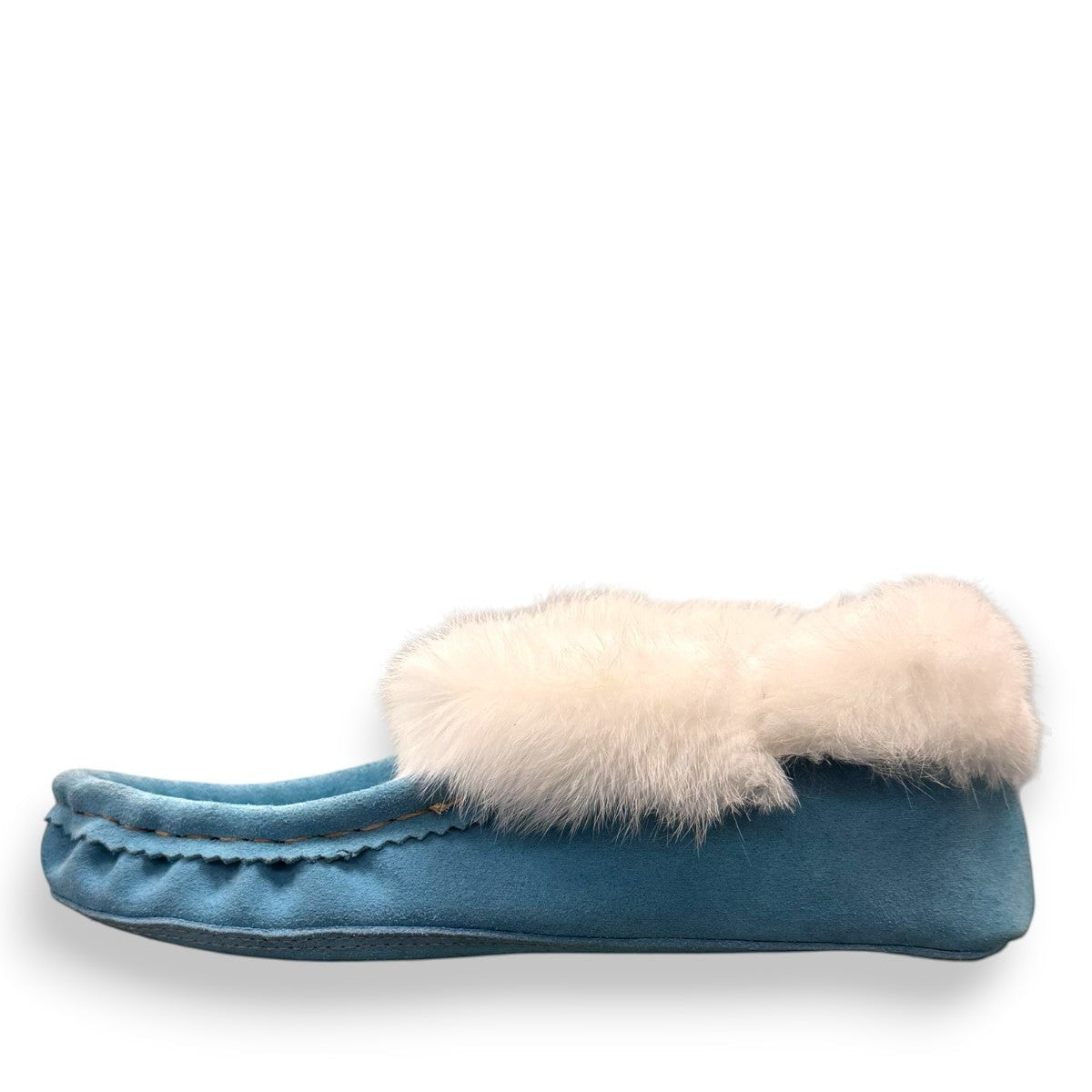 Alberta turquoise cowhide suede moccasins with a soft white rabbit fur ankle trim, handcrafted design.
photo of the left side