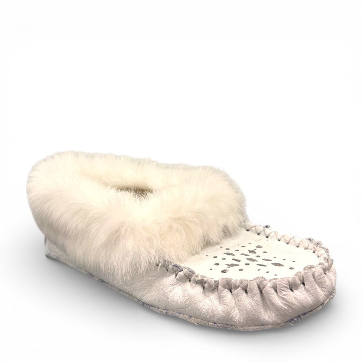 Alberta  white leather moccasins featuring a plush fur collar and side brand tag, side view.
photo of the front side