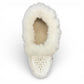 Alberta  white leather moccasins featuring a plush fur collar and side brand tag, side view.
photo of the top side
